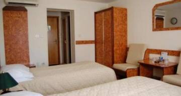 Фото номера Двухместный номер с 2 отдельными кроватями Отель Euro Hotel г. Тимишоара 3