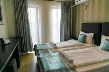 Фото номера Двухместный номер с 2 отдельными кроватями Гостевой дом May Residence г. Тимишоара 3
